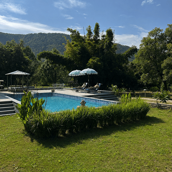 Sunny Poolside Retreat with Mountain Views-Surya Bagh