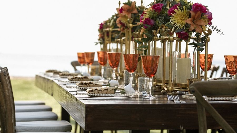Beach wedding with floral decorations and seating