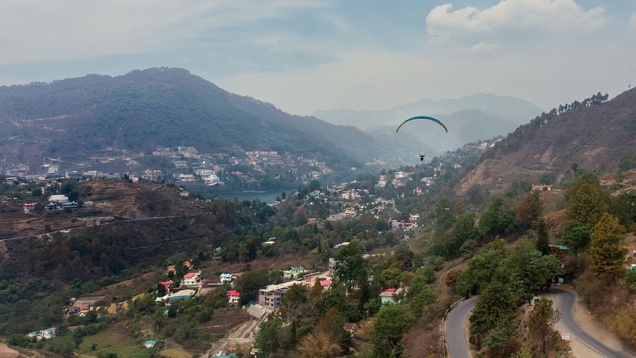 a view of the hills with buildings spread across at Mountoria Retreat, Naukuchiatal