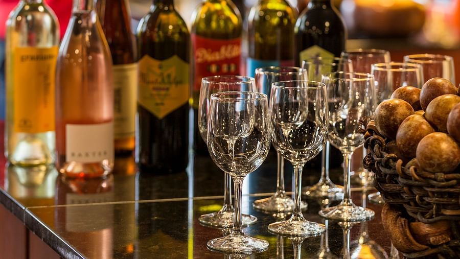 A lively bar with fine wines and spirits on display - Brewery Gulch Inn & Spa