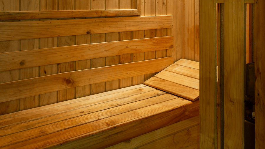 Image of a room with a wooden bed and wooden interior.