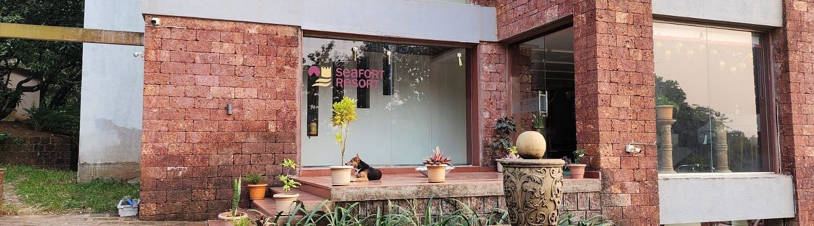 The entrance of the resort with antique pots placed on the side as decoration at SeaFort Beach Resort