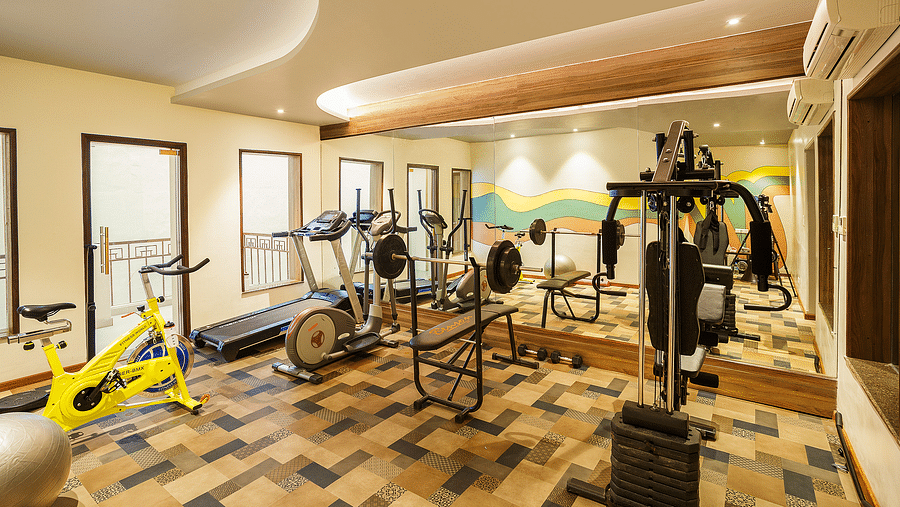 A modern gymnasium with equipment to work out - The Manor, Bareilly
