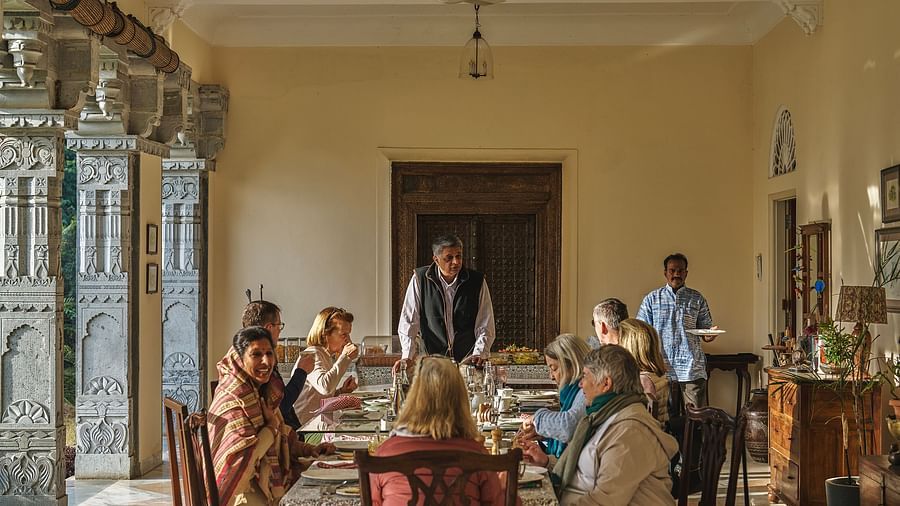 an image of people having food in the dining space at dev shree, deogarh