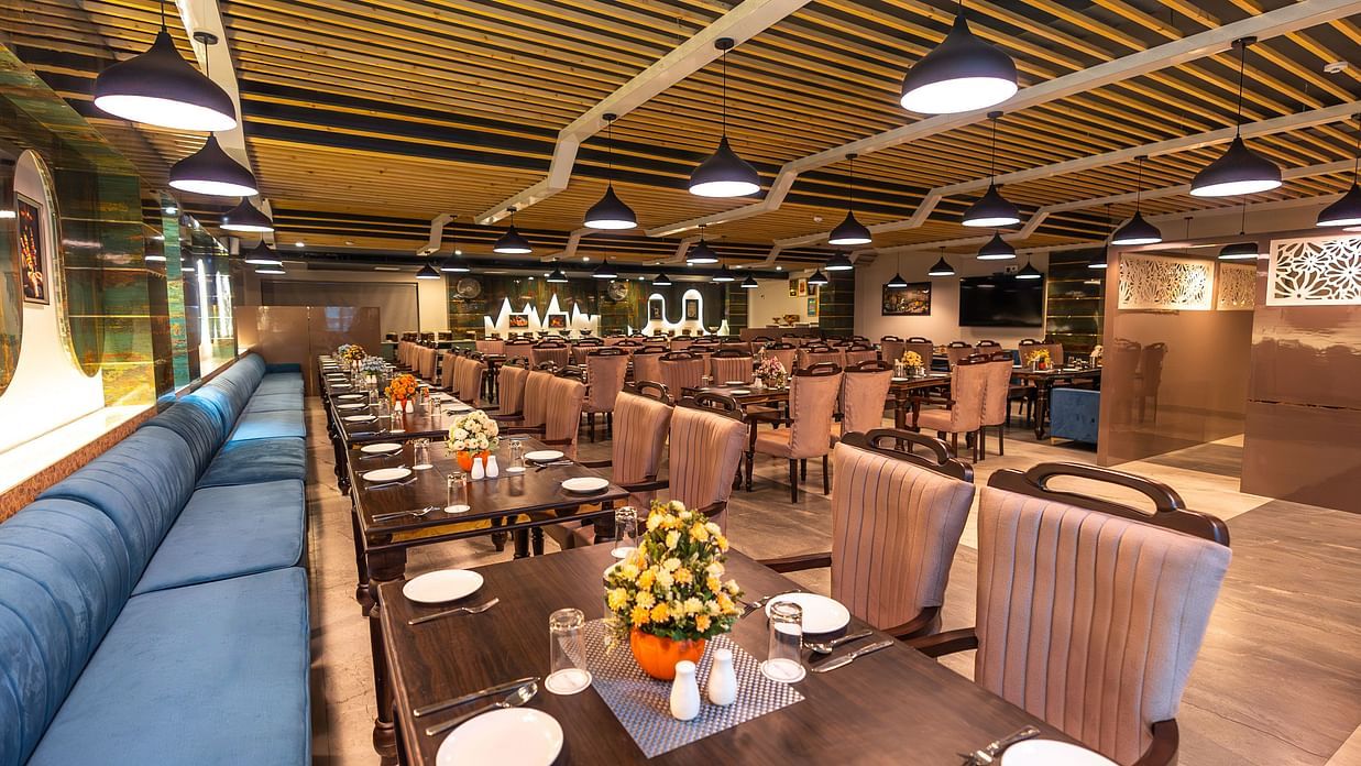 tables and chair seating arrangement in the restaurant - The Bridge