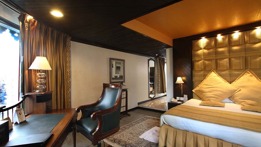 A beautifully decorated dining area with elegant furniture and a view of the outdoors.