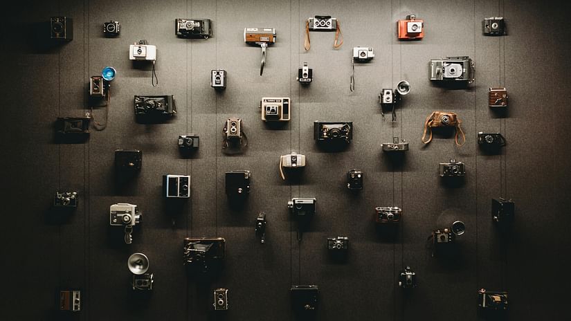 An overview of Vintage cameras showcased on a wall - Karma Lakelands.