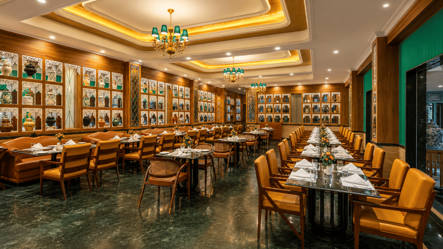 Tea Pot restaurant interior with decorative lighting at Mayfair Oasis Resort, Jharsuguda