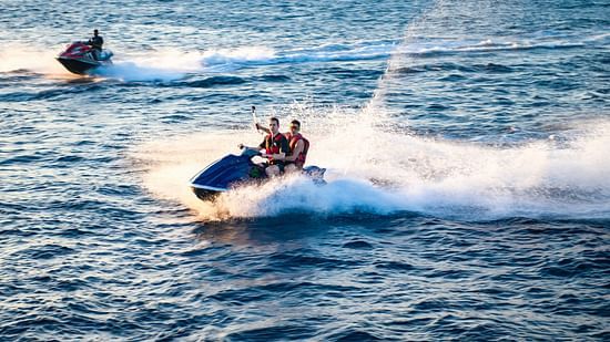 People having a great time using jet skis