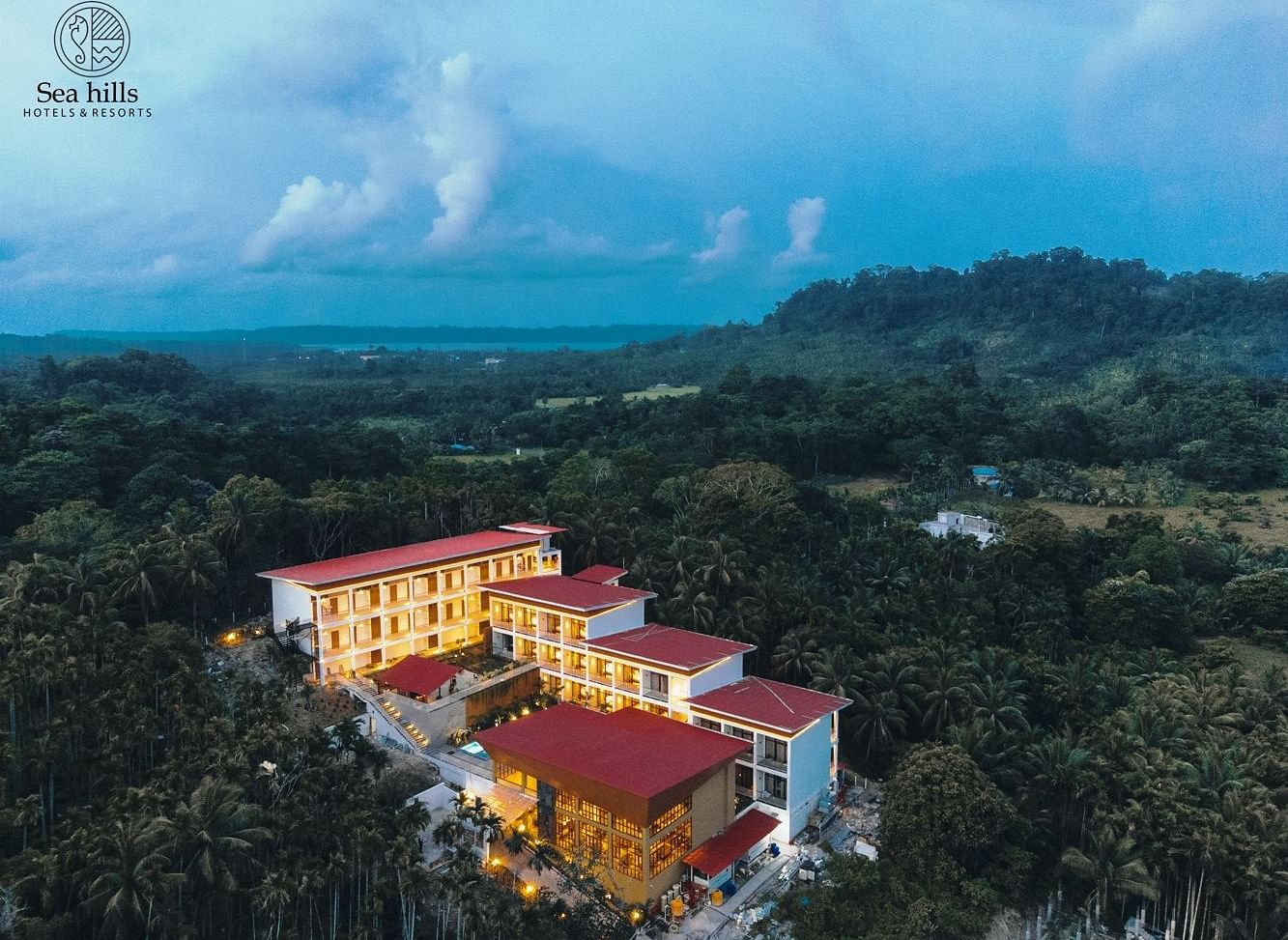Panoramic aerial view of the Sea Hills Hotels & Resorts, showcasing the property surrounded by lush greenery and tropical landscape - Sea Hills Resort, Swaraj Dweep (Havelock)