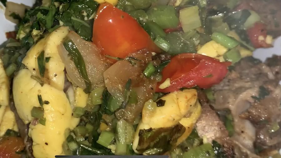 A meal featuring meat and a green salad | Altamont Court, Jamaica