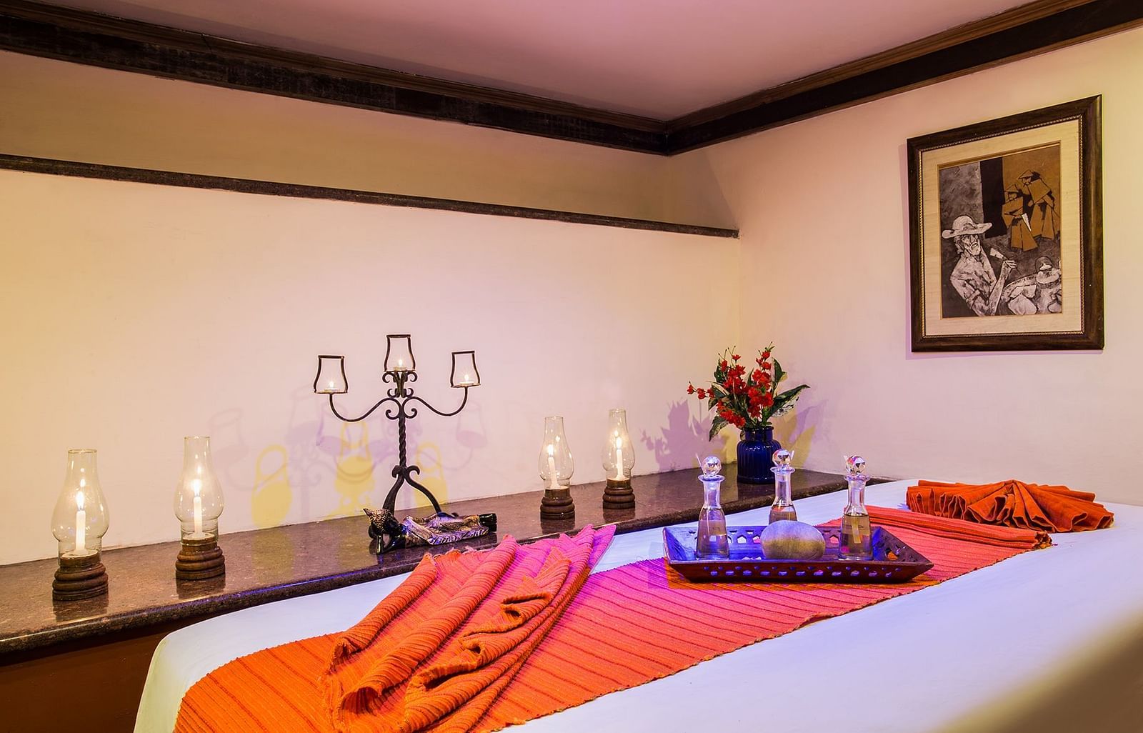 A spa table and candles beside it in a treatment room at our Spa in Nainital