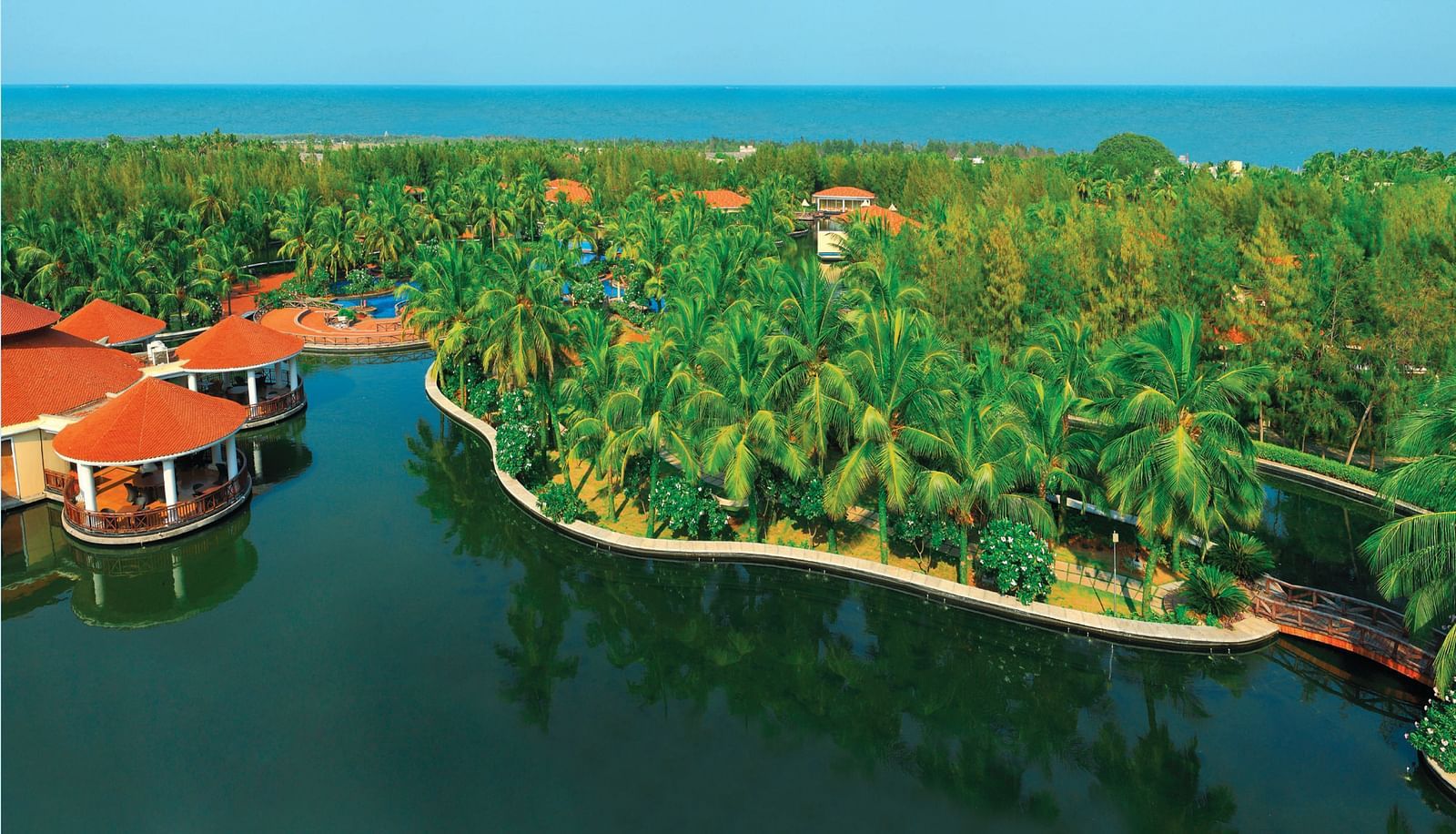 Aerial View with Sea of Ocean Spray, Puducherry with trees and lake in view