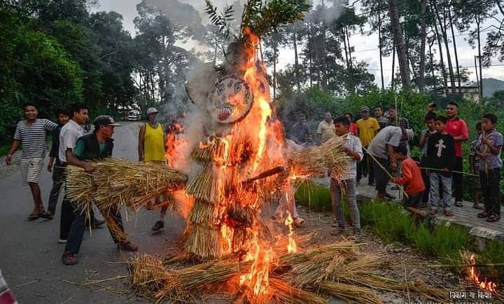 Three-legged effigy burning during the Gatha Muga Charhe festival