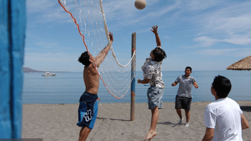 Guests playing Beach Volley Ball at The Retreat Hotel and Convention Centre Madh Island