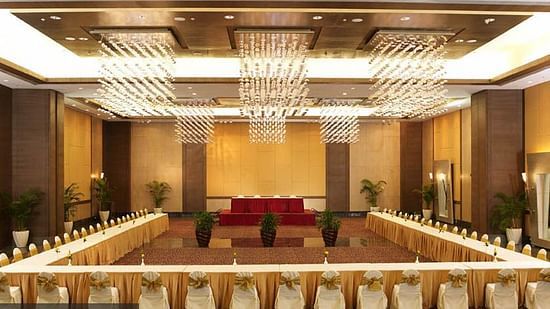 An image of the convention centre where tables are set up in our Convention Centre at The Retreat Hotel and Convention Centre with warm decorative lighting