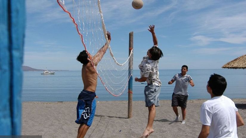 guests playing Beach Volley Ball at The Retreat Hotel and Convention Centre Madh Island