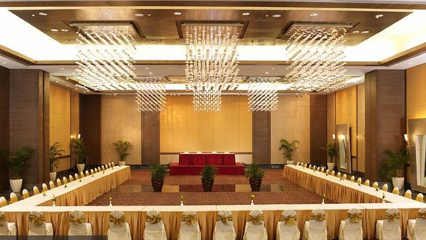 An image of the convention centre where tables are set up in our Convention Centre at The Retreat Hotel and Convention Centre with warm decorative lighting