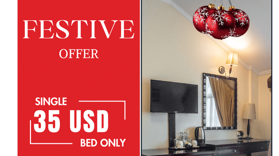 Boma Inn Nairobi is promoting a Festive Offer of 35 USD for a single room, which includes pool, gym, and steam access, shown with a Christmas-decorated hotel room photo.