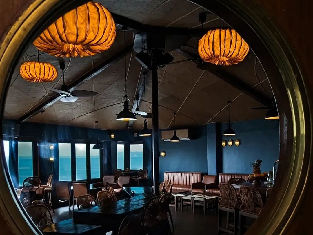 A narrow view of Bar Outrigger under ambient low lighting and thematic settings