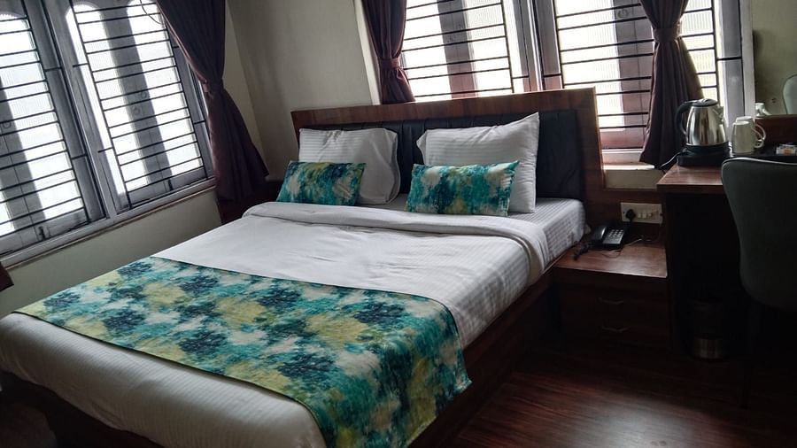 side view of the double bed inside Premium Room without Balcony - Ecotel Kolkata
