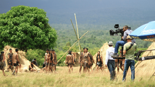 An image of a two people conducting a shoot in an open field