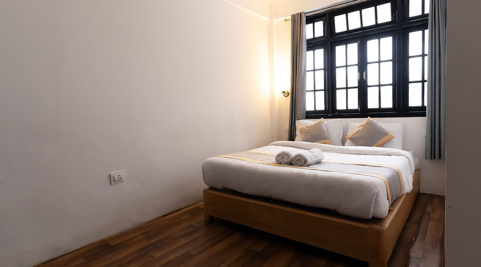 view of the comfort room with large bed and a window in the background at Mystique Valley Resort  