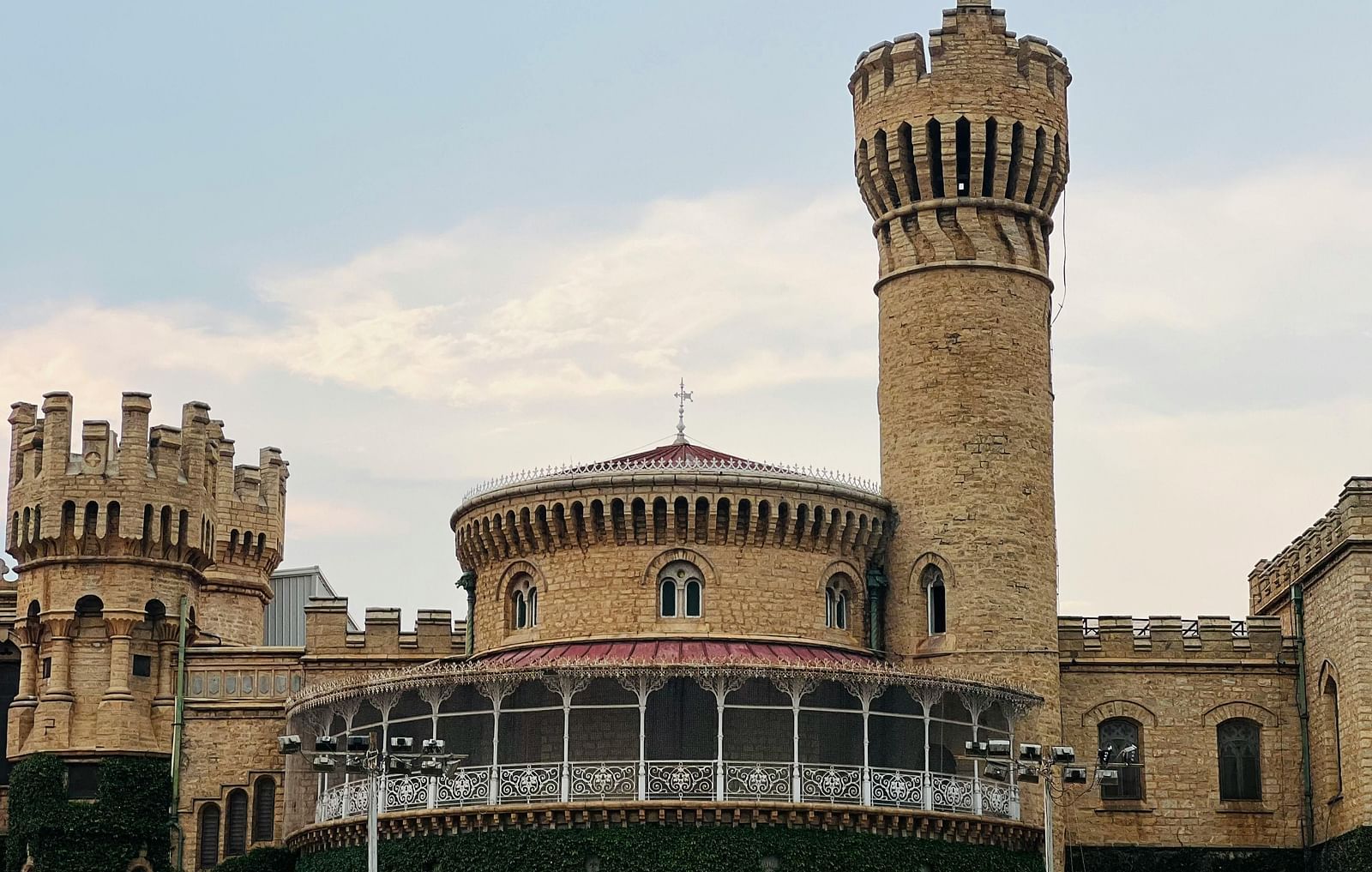 a beautiful facade view of a palace taken during an evening