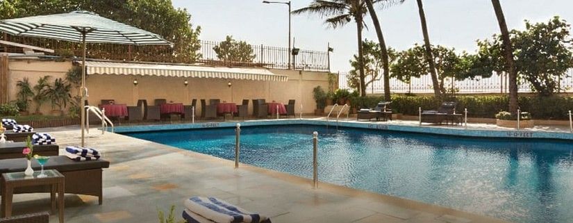 poolside patio at Ramada Plaza Palm Grove 204