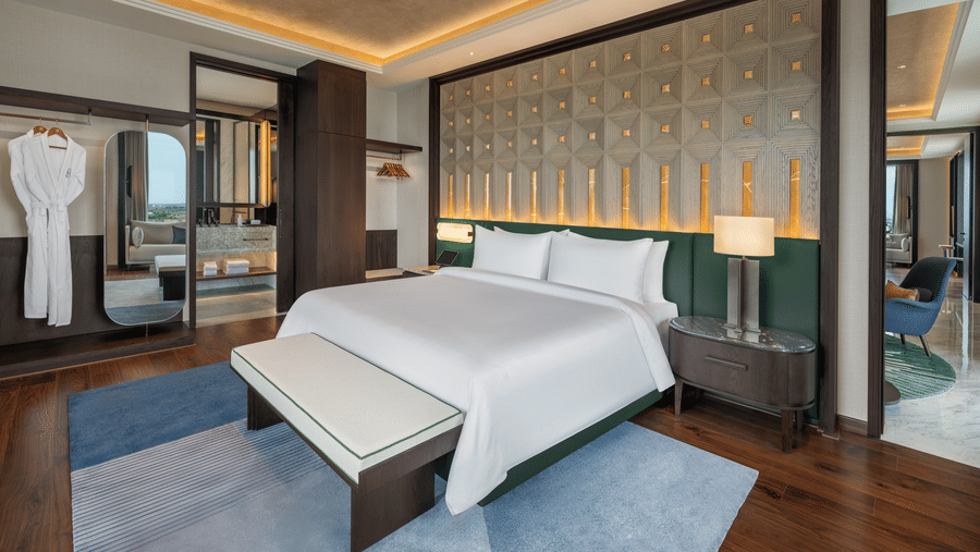 Executive Suite Room 8027 Bedroom 2 with a bed and warm ambient lighting at The Residency Signature Madurai.