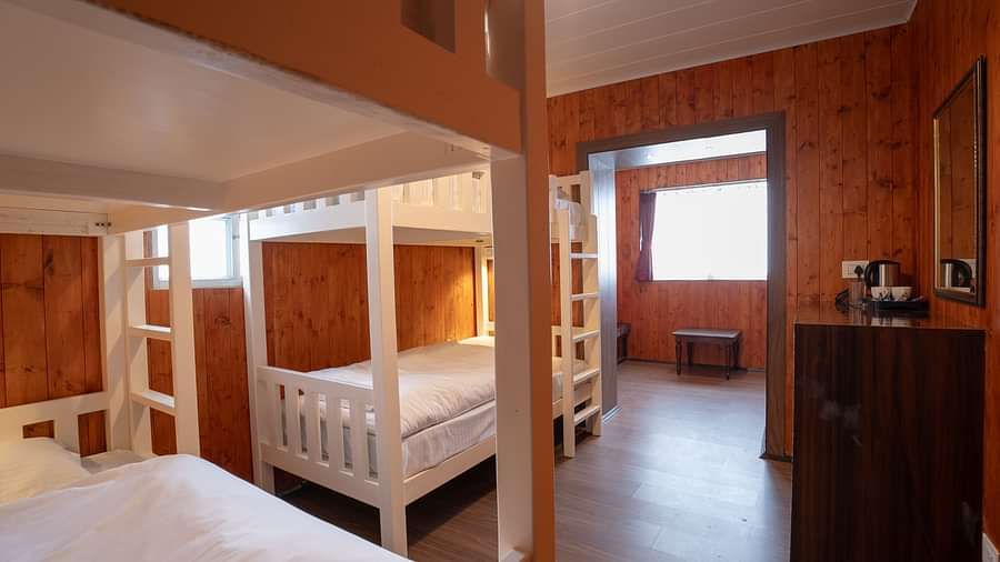 Bunk beds in a room at Poshtel, Meghma