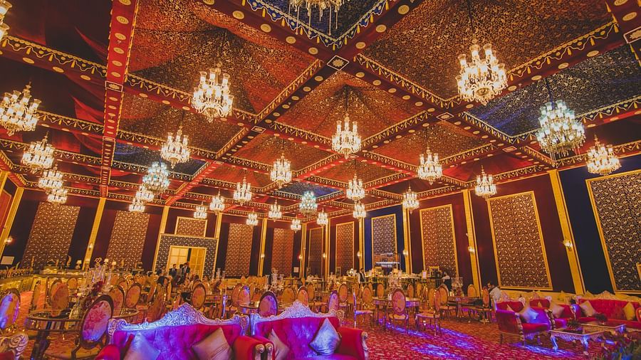 Image of Swarn Mahal with multiple chandeliers hanging from the ceiling at Rajasthali Resort & Spa Jaipur.