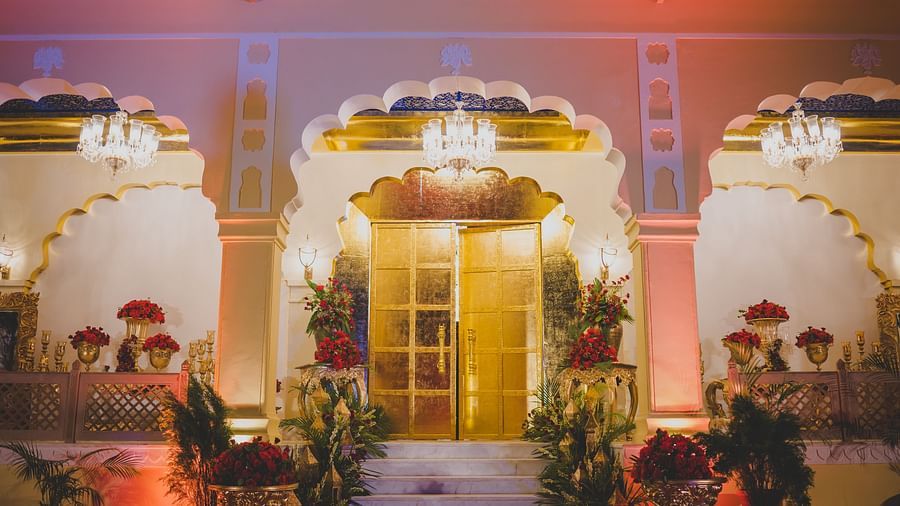 Image of the entrance of Swarn Mahal decorated with plants and flowers on the side at Rajasthali Resort & Spa Jaipur.