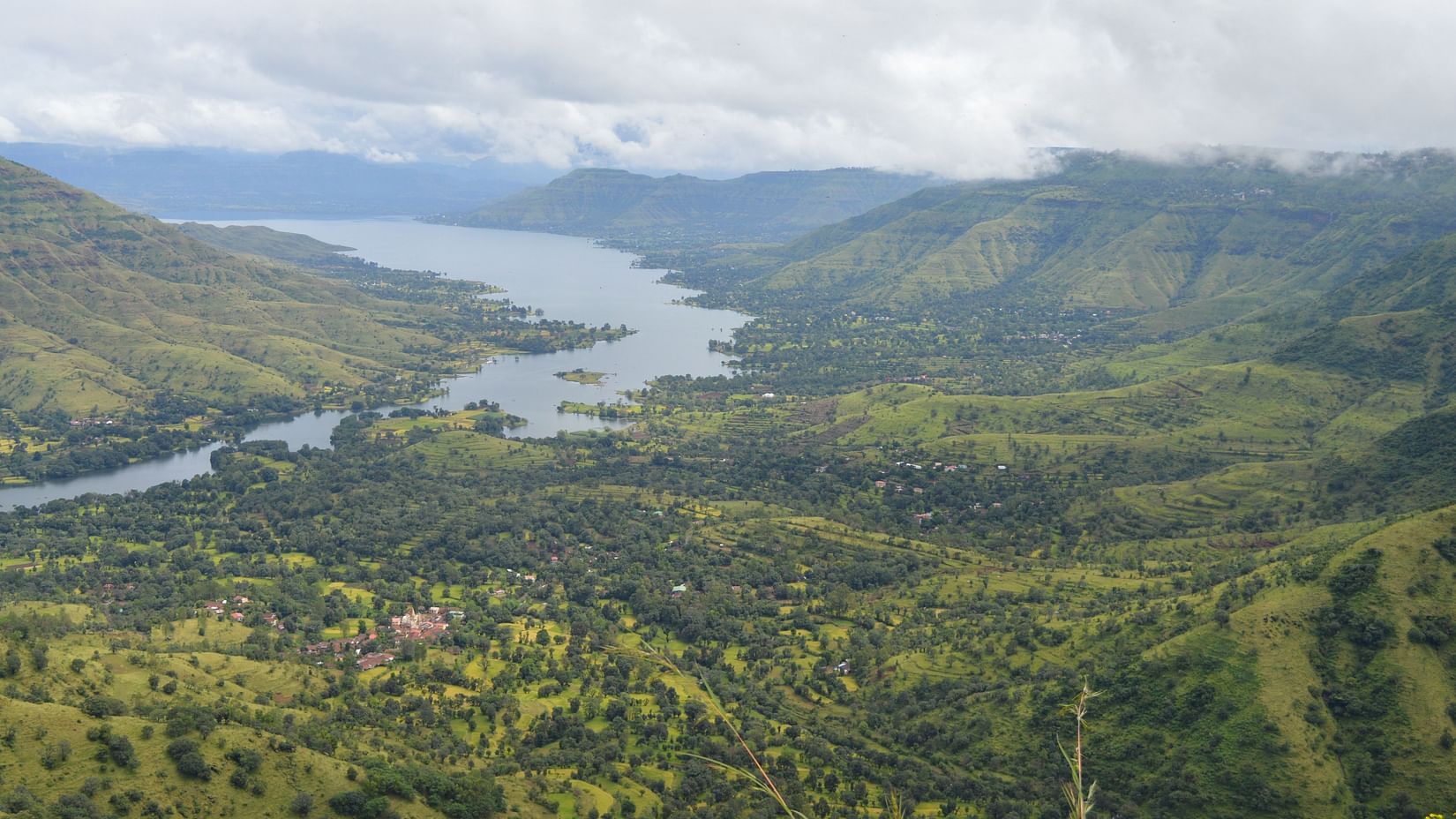 a panoramic view of a hill station with lush greenery everywhere