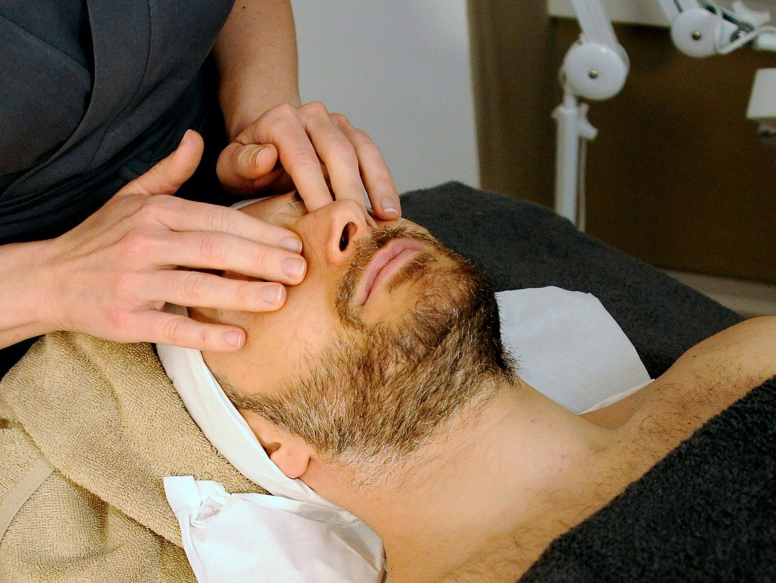 A person receiving a facial treatment - Alibu Resort Nha Trang