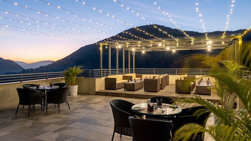 view of dining in an open roof of Tara - The Terrace Cafe at Stone Wood Hotel, Kumbhalgarh