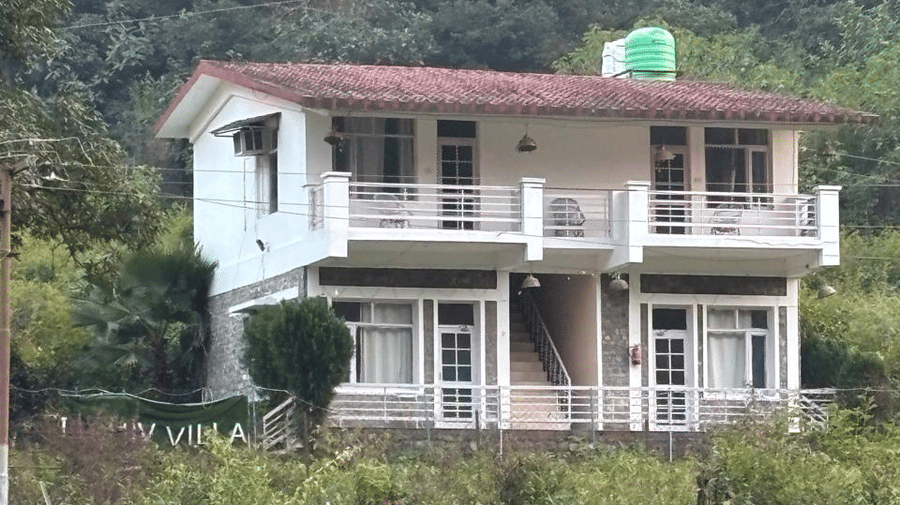 Facade of Mohan Chetti by eastlynn experiences surrounded by lush green hills.