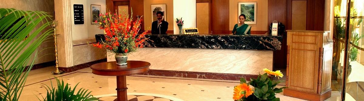 Lobby with plants at Beverly Hotel Chennai