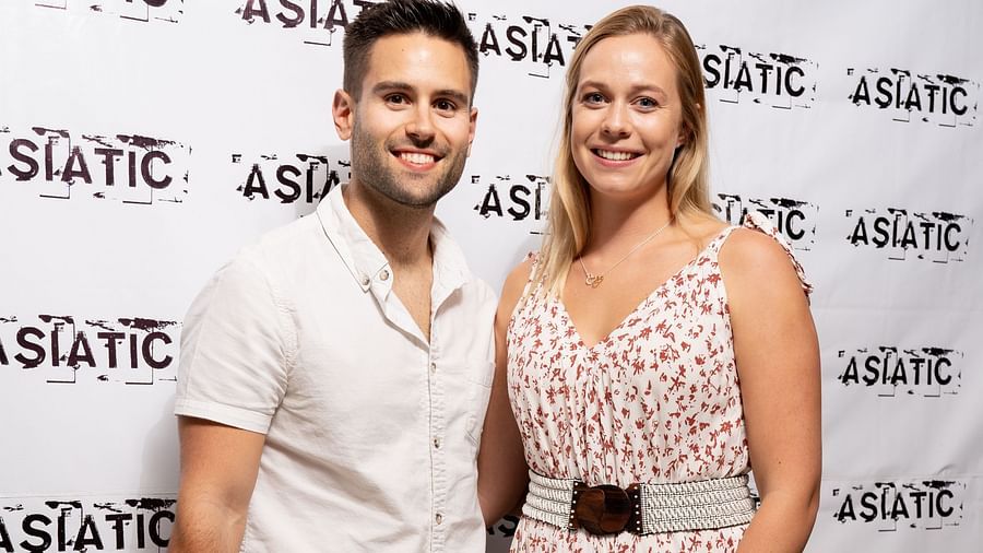 A man and a woman posing for an event at Asiatic Lounge