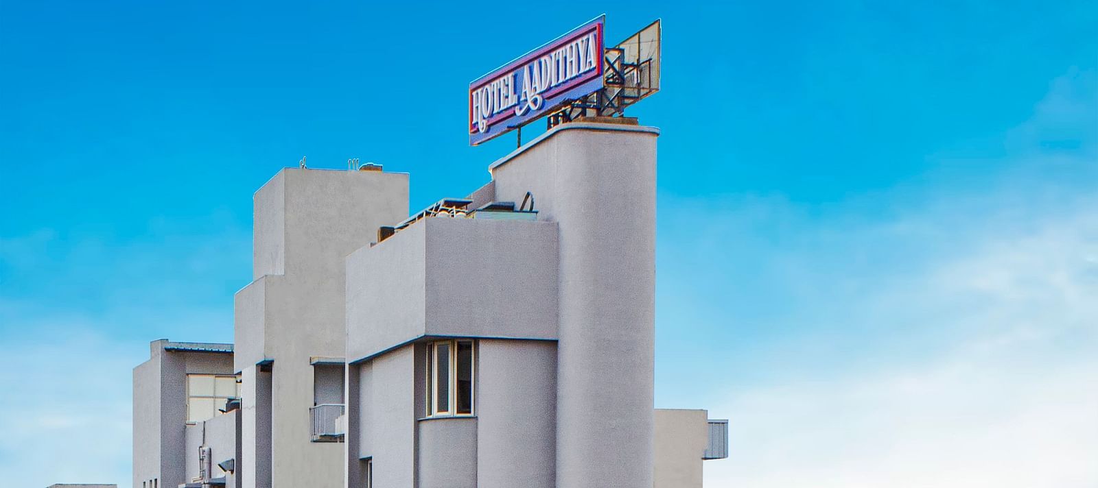 A bright morning view of the facade of Hotel Aadithya, Chennai