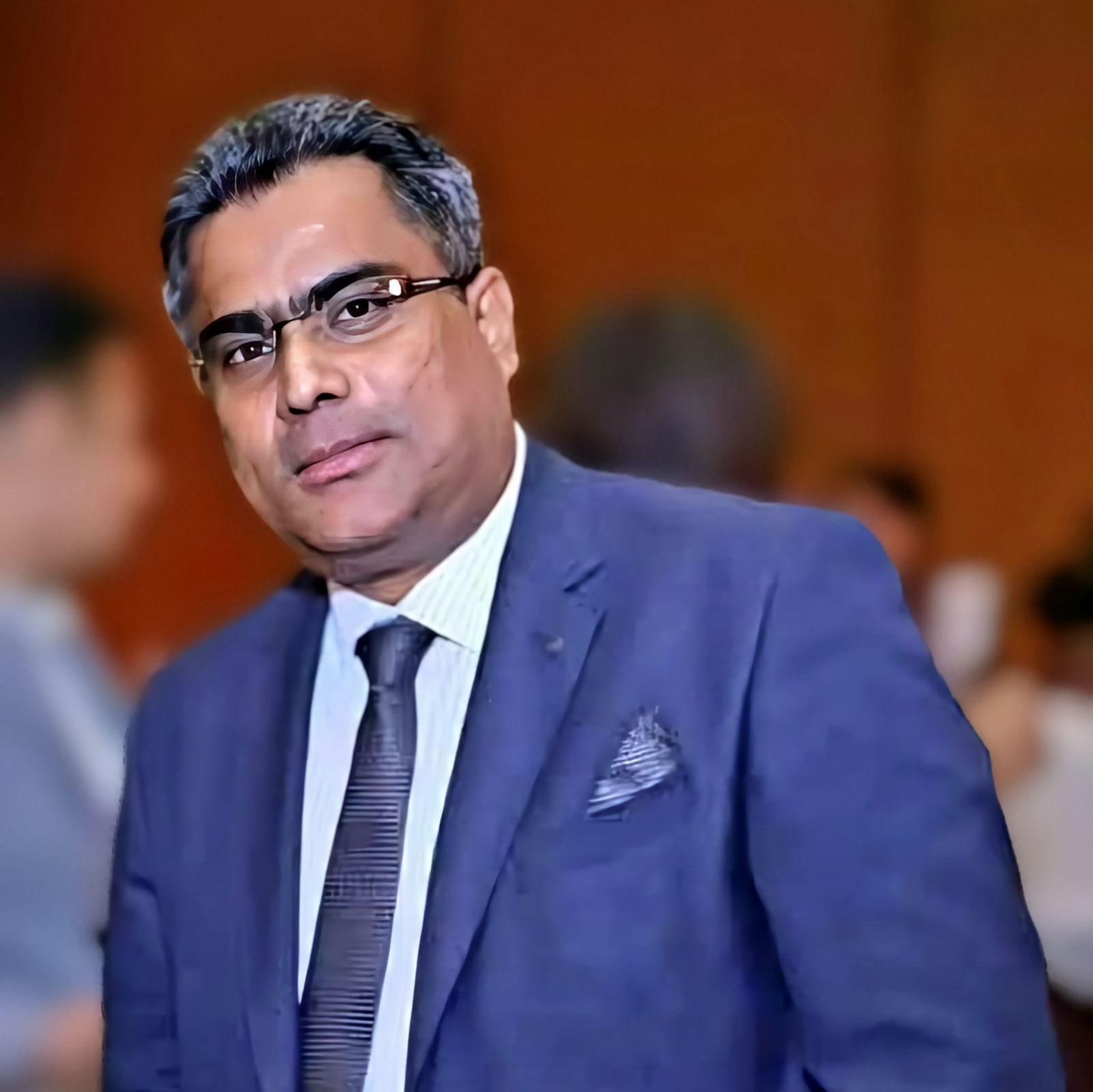 A shot of a man wearing blue formal wear at Vedic Village Spa Resort.