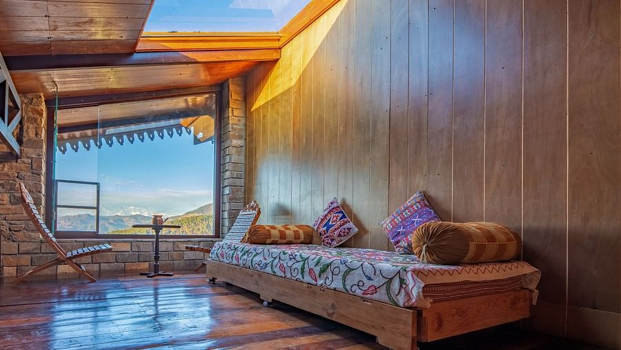 A wide-angle shot of the snow-covered Himalayan mountain range under a deep blue sky. - Blusalzz Homes The Himalayan Bungalow, Almora