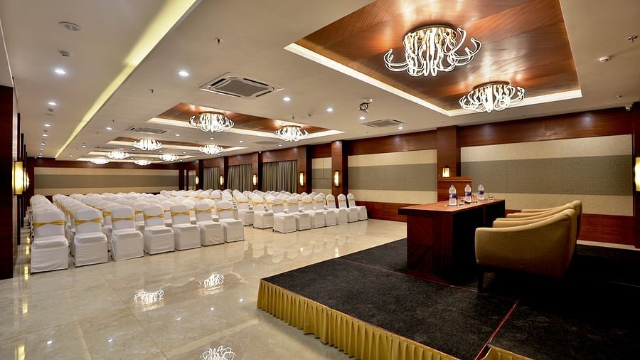 Theatre style seating arrangements with a desk on the podium inside the Banquet hall - VITS Devbhumi, Dwarka