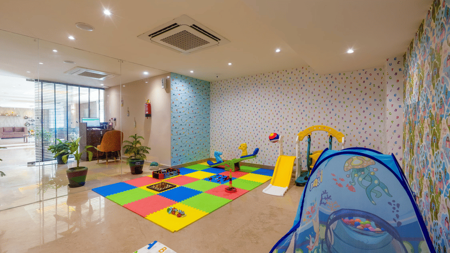 The indoor kids' play area at Hotel 91 Privé, Gurugram, featuring various toys.