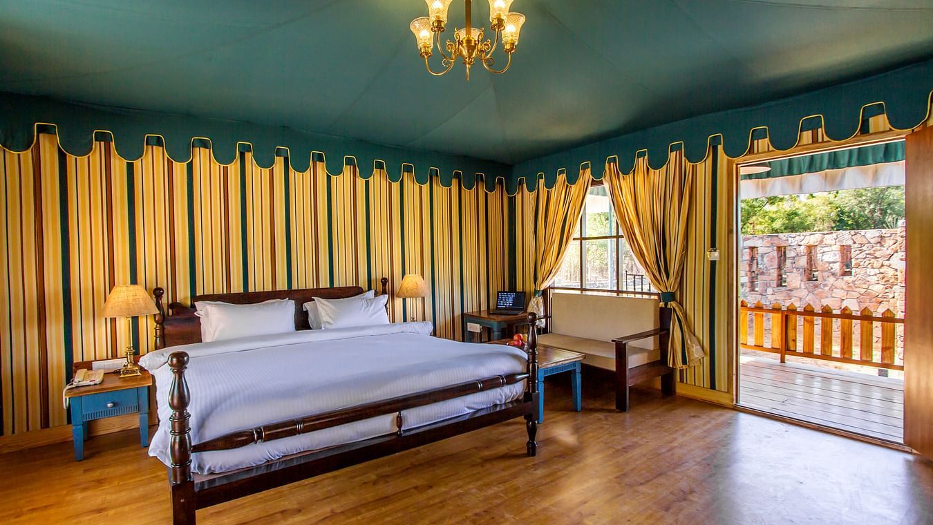 a king size bed of one of the tents in Ranthambore at The Baagh Ananta Elite