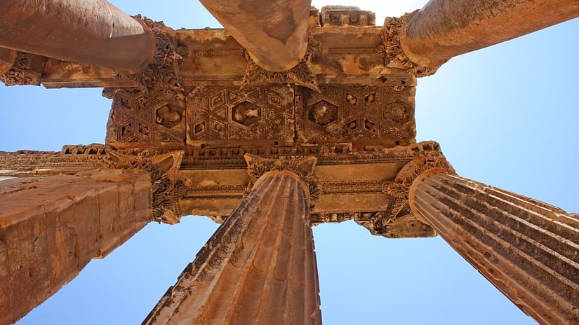 bottom view of pillared ruins during daytime