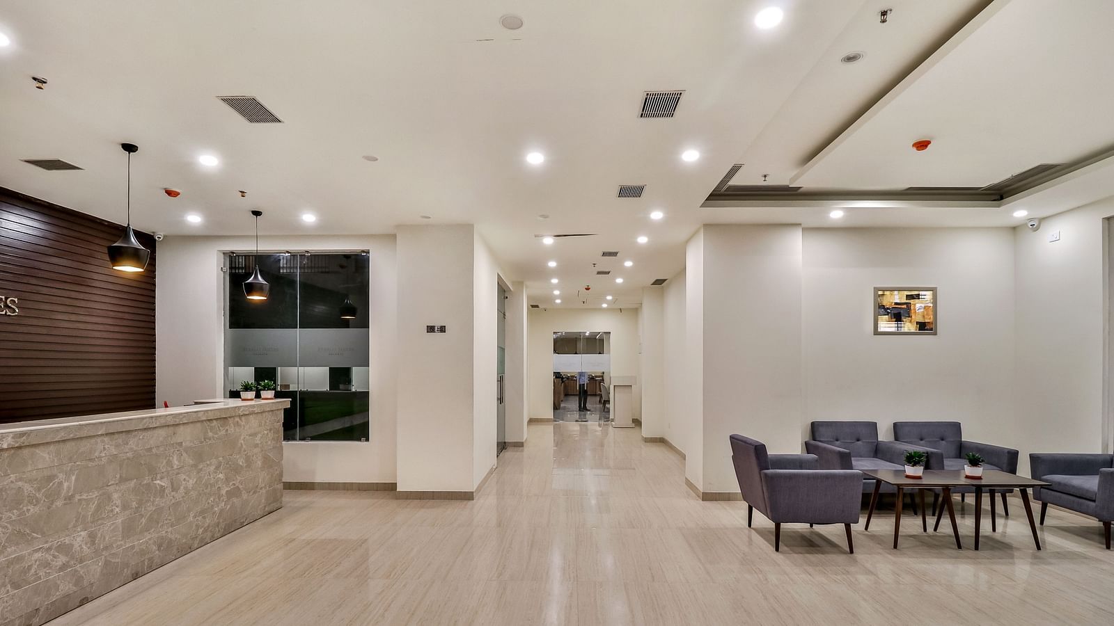 Reception Area and sofas opposite it - Starlit Suites Newtown, Kolkata
