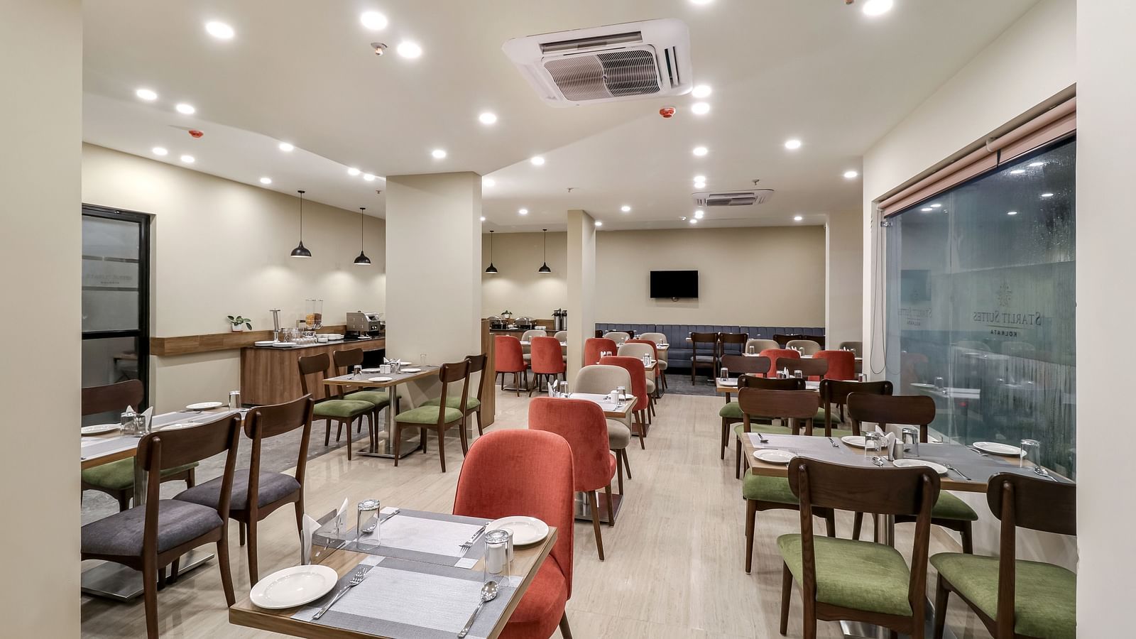 Seating arrangement inside Gourmet 1 - Starlit Suites Newtown, Kolkata