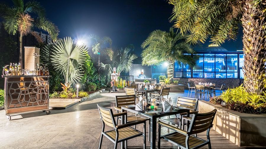Chairs around the pool at Golden Suites, Gurgaon