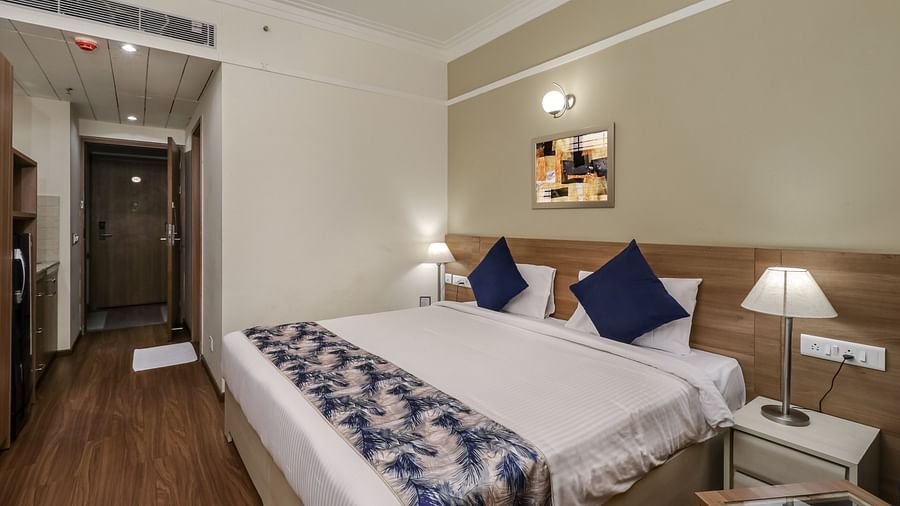 A double bed inside Premium Studio - Starlit Suites Newtown, Kolkata